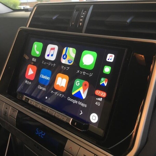 Clarion NXV-987D radio installed in Toyota Land Cruiser Prado dashboard showing unlock code entry interface