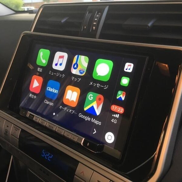 Clarion NXV-987D radio installed in Toyota Land Cruiser Prado dashboard showing unlock code entry interface