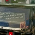 Clarion NXV987D Radio Code displaying unlock code entry screen with step-by-step solution guide"