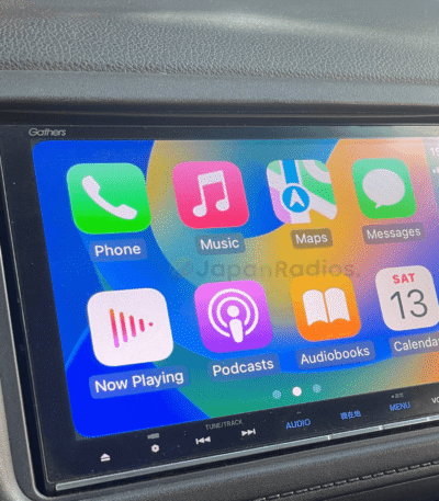 Gathers VXM-175VFni head unit displaying Apple CarPlay interface with iPhone connected via USB cable after SD card installation