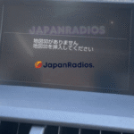 Lexus NX200t Map SD Card Error Lexus NX200t infotainment screen displaying a Japanese map SD card error message prior to an English language system conversion.