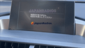 Lexus NX200t Map SD Card Error Lexus NX200t infotainment screen displaying a Japanese map SD card error message prior to an English language system conversion.
